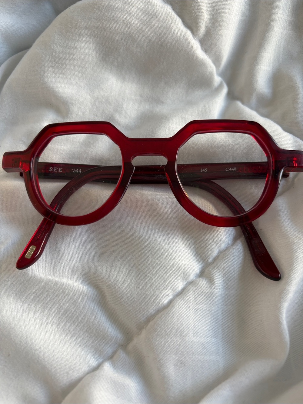 Translucent Ruby Red Angular Round Glasses